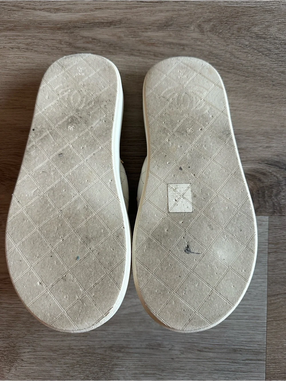 CHANEL 23S White Quilted Logo Flip Flops with Gold Charms